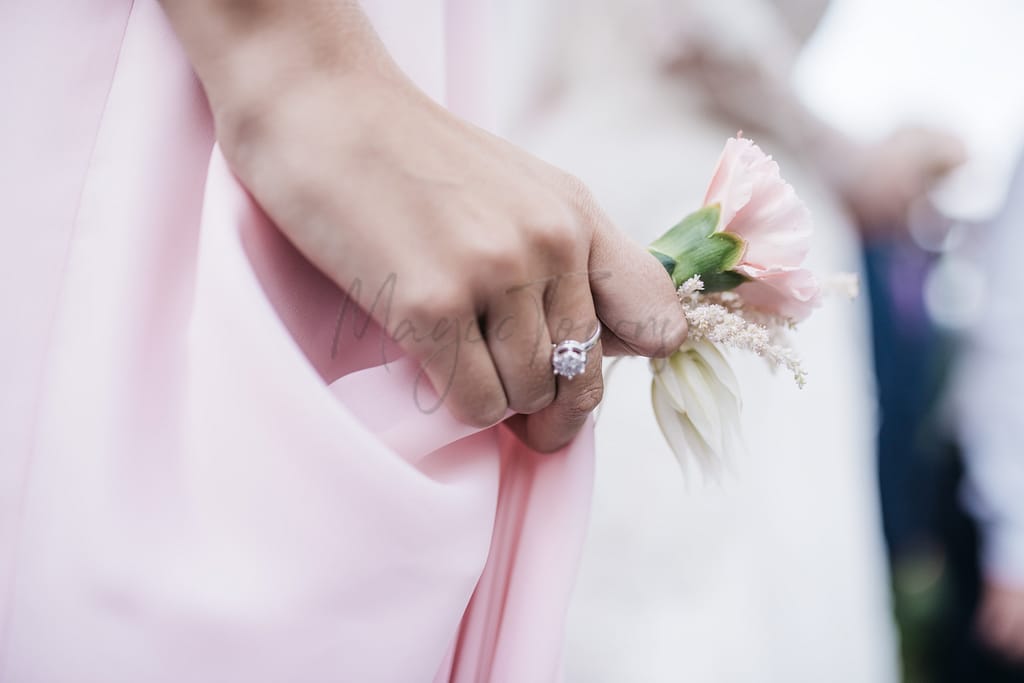 A bride holding a flower
